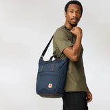 Fjallraven High Coast Totepack backpack with top handle and adjustable shoulder straps, made of durable fabric in black color.