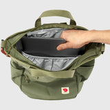 Fjallraven High Coast Totepack backpack with top handle and adjustable shoulder straps, shown in detail with green fabric and leather accents.