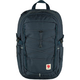 Fjallraven Skule 28 backpack in durable green fabric with adjustable straps and front pocket, designed for outdoor use and daily carry.