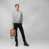 Fjallraven Kanken Mini backpack in durable fabric with top handle and adjustable shoulder straps, featuring the iconic logo patch.