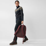 Fjallraven Raven 28 backpack in dark gray with adjustable shoulder straps and multiple compartments, ideal for hiking and daily use.