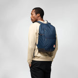 Fjallraven High Coast Backpack 24 in navy blue with adjustable shoulder straps and front zip pocket, designed for everyday use.