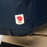 Fjallraven High Coast Backpack 24 in navy blue with adjustable straps, front pocket, and minimalist design.