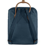 Fjallraven Kanken No. 2 backpack in classic design with top handle and adjustable shoulder straps, shown in dark green.