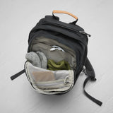 Fjallraven Raven 20 backpack in black with multiple compartments and adjustable straps, designed for outdoor and everyday use.