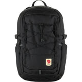 Fjallraven Skule 20 backpack in dark green with adjustable straps and multiple compartments, designed for outdoor and everyday use.