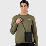 Black Fjallraven Pocket Bag crossbody bag with adjustable strap and zippered compartments, made of durable material.