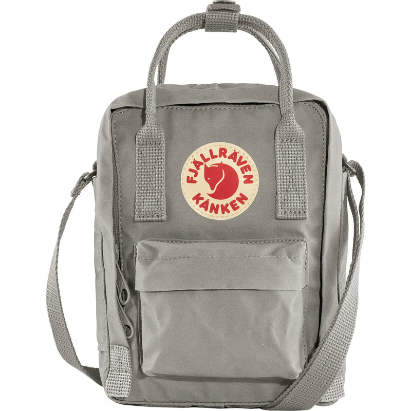 Navy Fjallraven Kanken Sling crossbody bag with adjustable strap and compact design, ideal for carrying essentials.