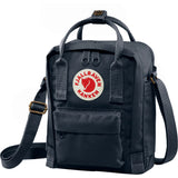 Navy Fjallraven Kanken Sling crossbody bag with adjustable strap and front zipper pocket, made of durable material.