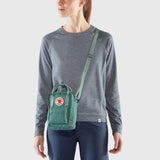 Navy Fjallraven Kanken Sling crossbody bag with adjustable strap and compact design, made of durable fabric.