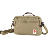 Fjallraven High Coast Crossbody Bag in patina green, compact and stylish with adjustable strap and multiple pockets.