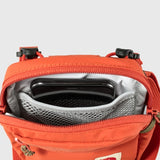 Fjallraven High Coast Pocket crossbody bag in Rowan Red, compact design with adjustable strap and zippered compartments.