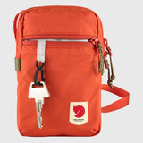 Red Fjallraven High Coast Pocket crossbody bag with adjustable strap and zippered compartments, casual outdoor style.