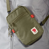 Fjallraven High Coast Pocket crossbody bag in Rowan Red, compact design with adjustable strap and front pocket.