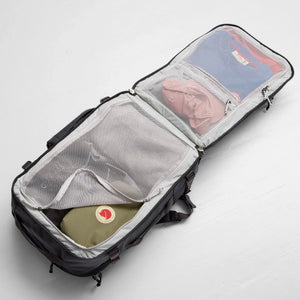 Fjallraven Farden Carry-on Pack in coal black, a travel backpack with multiple compartments and ergonomic shoulder straps.