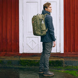 Fjallraven Farden Carry-on Pack in dark green, compact travel backpack with multiple compartments and padded shoulder straps.