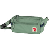 Green Fjallraven High Coast Hip Pack waist bag with adjustable strap and multiple compartments for outdoor and everyday use.