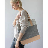 Graf Lantz Jaunt Merino Wool Tote bag in granite and natural colors, showing the stylish, spacious design with soft wool texture.