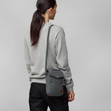 Greenland Pocket Bag by Fjallraven in green, featuring a compact crossbody design with a front pocket and adjustable strap.