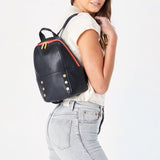 Hammitt Hunter Med Backpack in black leather with adjustable straps and multiple compartments, front pocket, and sleek design.