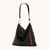 Hammitt Kyle Lrg handbag in black brushed gold leather with silver hardware, showcasing its sleek design and top handle.