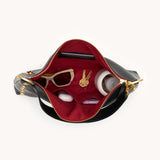 Black Hammitt Kyle LRG handbag with brushed gold hardware, featuring a sleek design and top handle for versatile style.