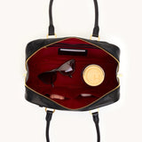 Hammitt Meredith Med handbag in black brushed gold leather with gold hardware, showcasing a stylish, medium-sized designer purse.
