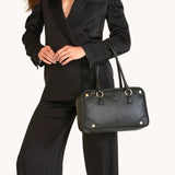 Hammitt Meredith Med handbag in black brushed gold leather with gold hardware, featuring a sleek and stylish design.