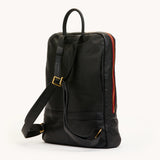 Hammitt Hunter backpack in black with brushed gold hardware and red zipper, featuring sleek design and adjustable straps.