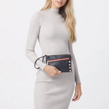 Hammitt Nash Small handbag in black brushed gold with red zipper, featuring sleek design and compact size.