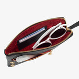 Hammitt Nash Small handbag in black brushed gold leather with red zipper detail and gold hardware.