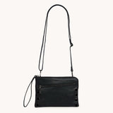 Hammitt Nash Small handbag in black brushed gold leather with red zipper, featuring a sleek, compact design.