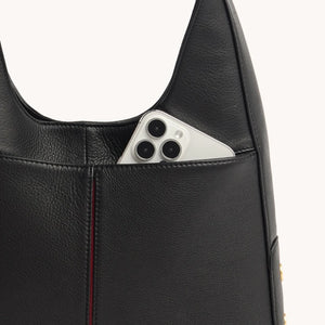 Hammitt Tim Med wallet with multiple card slots and zipper closure, shown in close-up detail on a neutral background.