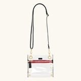 Hammitt Tony Small handbag in clear black material with brushed gold hardware, showcasing its compact, stylish design.