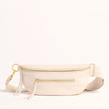 Hammitt Charles Crossbody Med bag in tan leather with adjustable strap and silver hardware, displayed against a neutral background.
