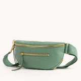Hammitt Charles Crossbody Med bag in tan leather with adjustable strap and silver hardware, displayed on a plain background.