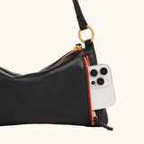 Hammitt Kyle SML crossbody bag with sleek leather design and adjustable strap, featuring modern style and compact size.