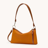Hammitt Kyle SML crossbody bag in black leather with silver hardware, showing its compact design and adjustable strap.