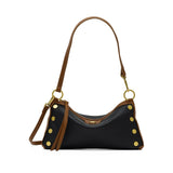 Black Hammitt Kyle SML crossbody bag with brushed gold hardware, showcasing its compact design and adjustable strap.