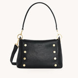 Black Hammitt Bryant Med crossbody bag with brushed gold hardware and red zipper detail, showcasing its stylish design.
