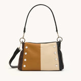 Hammitt Bryant Med crossbody bag in black brushed leather with gold hardware and red zipper details.