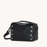 Black Hammitt Evan Crossbody Small bag with red zipper and brushed gold accents, stylish and compact for everyday use.