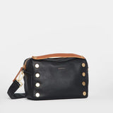 Hammitt Evan Crossbody Sml bag in black brushed leather with gold hardware and red zipper, compact and stylish for everyday use.