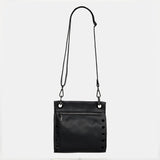 Black Hammitt Tony Med crossbody bag with sleek design and gold accents, showcasing the stylish and functional accessory.