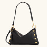 Black Hammitt Kyle Med handbag with brushed gold hardware and a red zipper, stylish leather handbag with a sleek design.