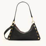 Black Hammitt Kyle Med handbag with brushed gold hardware and red zipper, showcasing a stylish and compact design.