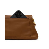 Hammitt Beverly Medium handbag in mahogany pebble leather with brushed gold hardware and red zip closure.