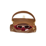 Hammitt Beverly Medium handbag in mahogany pebble leather with brushed gold hardware and red zipper details.