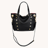 Black Hammitt Daniel Med purse with brushed gold accents and red zipper, featuring a sleek, stylish design.