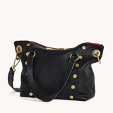 Black Hammitt Daniel Med purse with brushed gold hardware and red zipper detailing, stylish and compact accessory.
